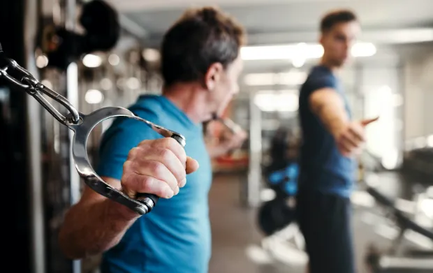Personal trainer working with client in a private Brickell gym studio